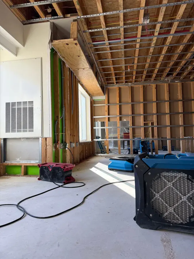 Drying equipment running in an opened-up room during a North Richland Hills dry-out